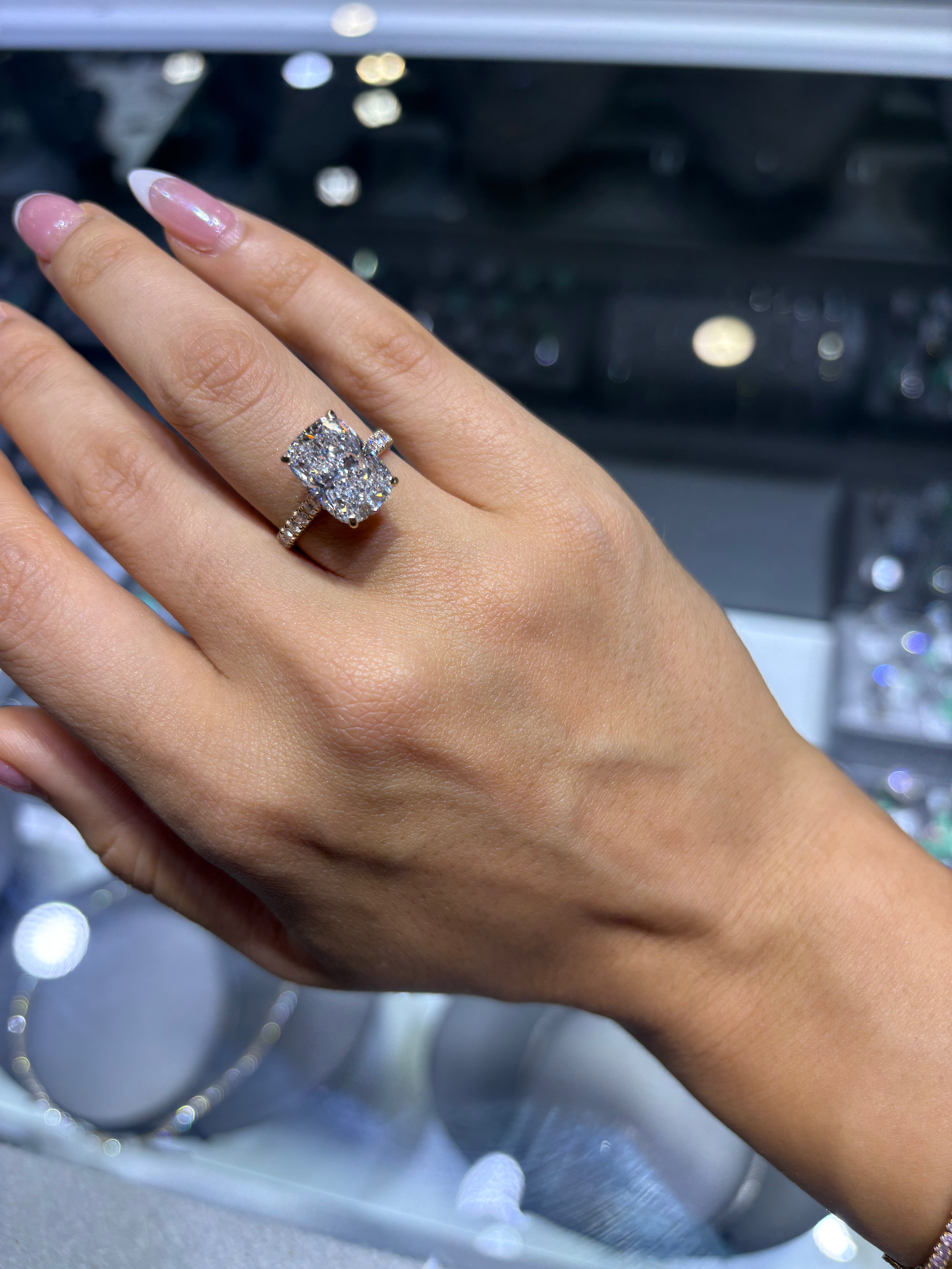 5.74 CT CUSHION BRILLIANT LAB DIAMOND RING • 5.06 CT CENTER • E COLOR • 14K YELLOW GOLD • VS1 • IGI CERTIFIED